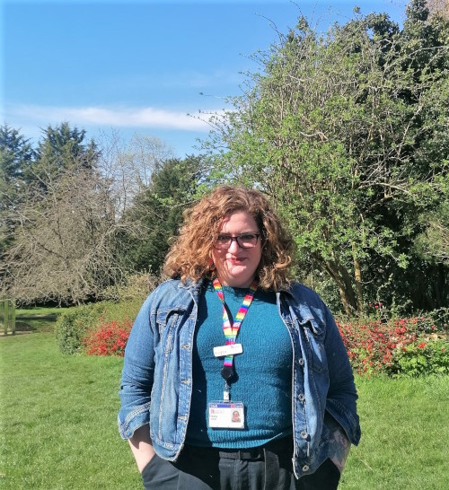 Rosey Crow standing outside in the sunshine in Royal Fort gardens.